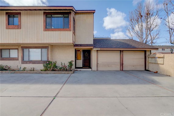 Front view of a two-story house with a double garage.