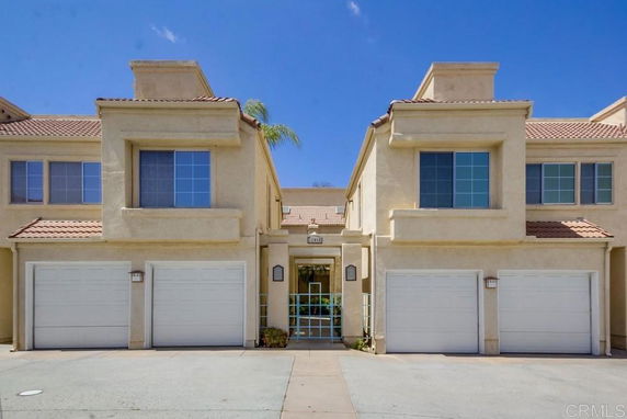 Front view of a two-story house with a double garage.