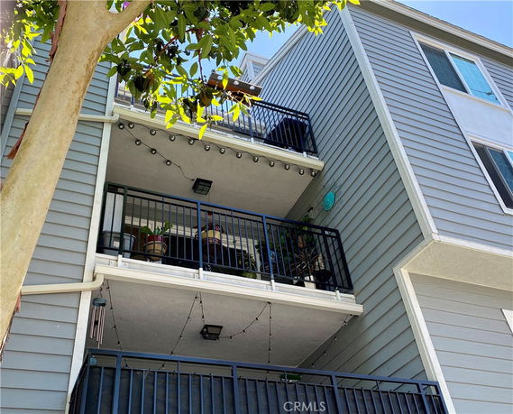 Exterior view of a multi-story building with balconies.