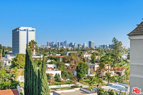 View of city skyline and surrounding buildings from an elevated position.
