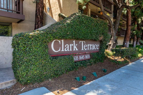 Front view of a residential building with a sign for Clark Terrace.