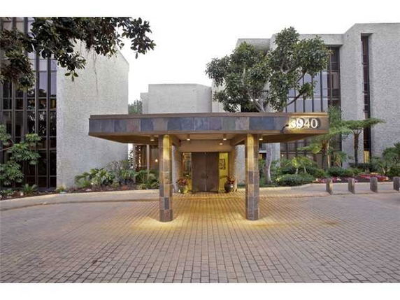 Front view of a building with a covered entrance.