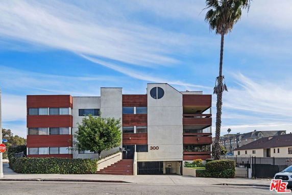 Front view of a multi-story residential building with a modern design.