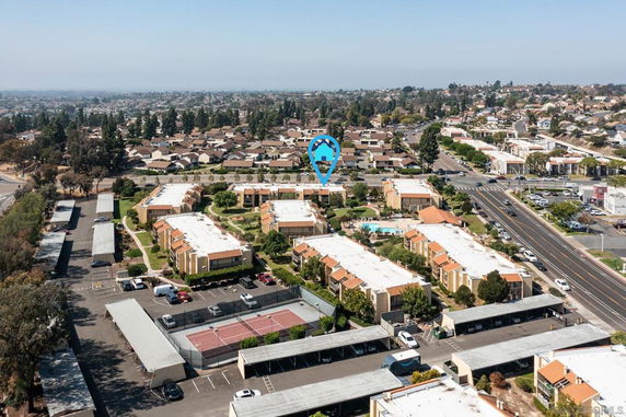 Panoramic view of residential complex with multiple buildings and surrounding neighborhood.