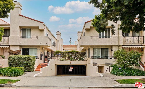 Front view of a residential building with two stories.