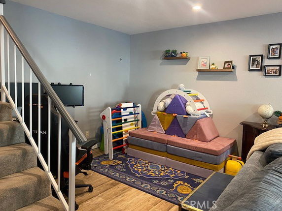 Indoor play area with toys and a small climbing structure.