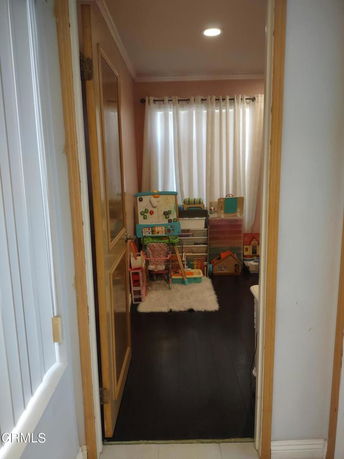 Room with children's play equipment and toys.