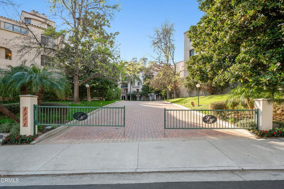 Front view of a gated entrance to a residential complex.