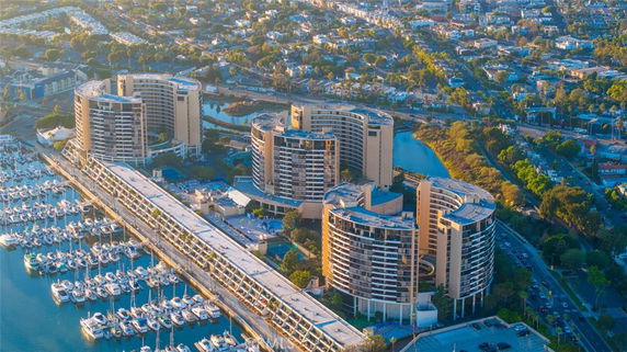 Wide-angle view of multiple high-rise buildings and surrounding marina.