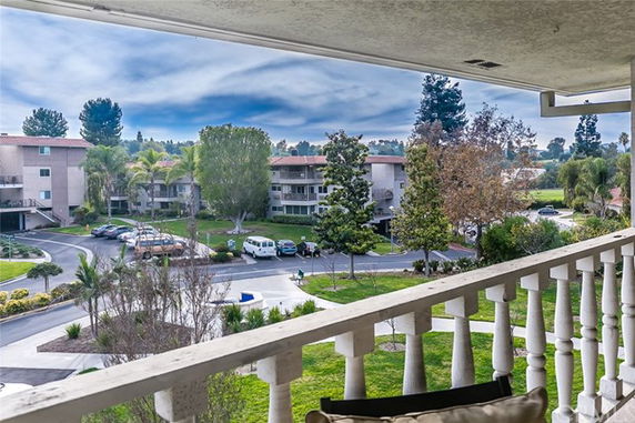 View of the surrounding residential area from a building balcony.