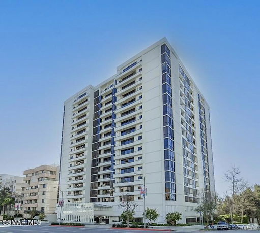 Front view of a multi-story residential building.