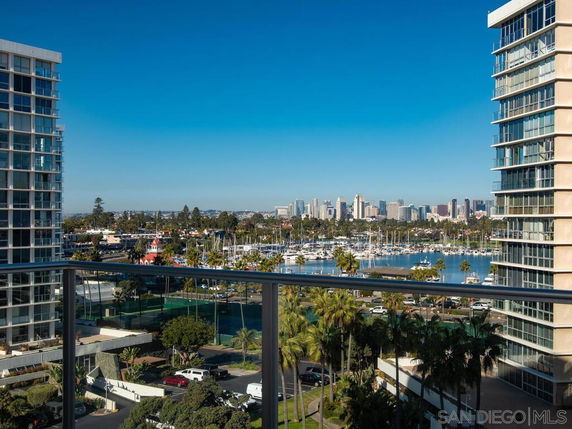 Panoramic view of urban landscape with high-rise buildings and marina.