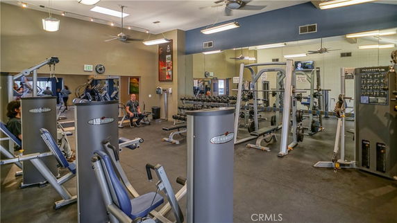 Interior view of a gym with various exercise equipment.
