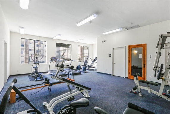 Indoor gym area with exercise equipment and a sauna.