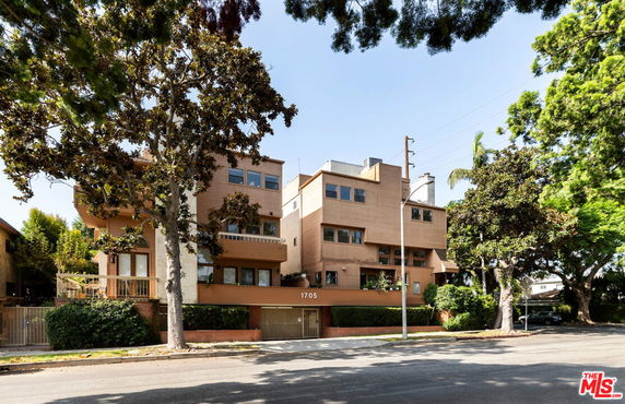 Front view of a multi-story residential building with a modern design.