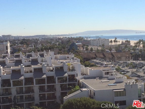Panoramic view of urban landscape with buildings and distant ocean