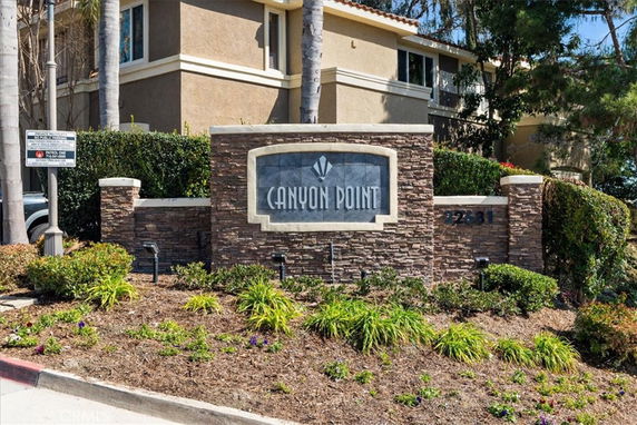 Front view of a building with a stone sign reading 'Canyon Point'.