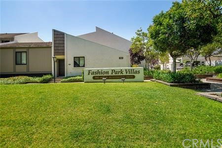 Front view of a building with a sign reading 'Fashion Park Villas'.
