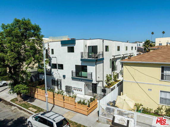 Front view of a modern multi-story apartment building.