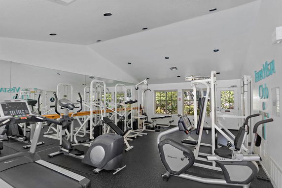 Interior of a fitness room with various exercise equipment.