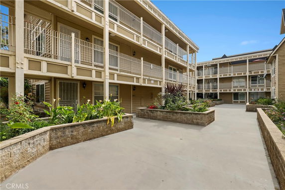 Exterior view of a multi-story residential building with balconies.