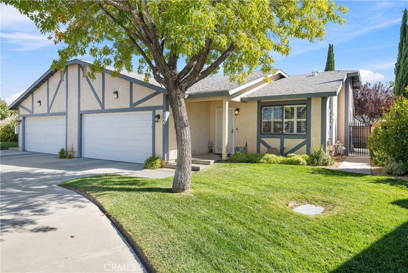 Front view of a single-story house with a three-car garage.