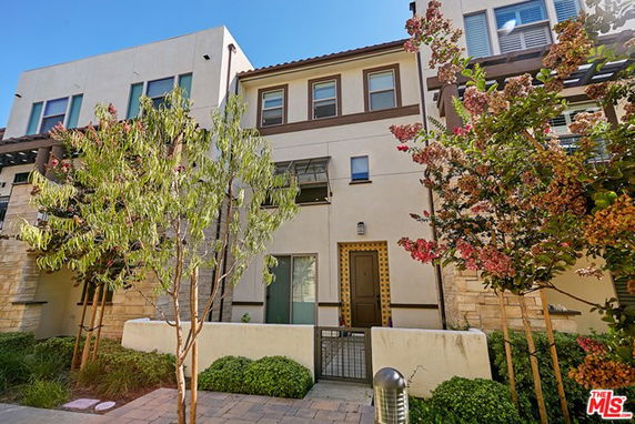 Front view of a two-story townhouse with modern design.