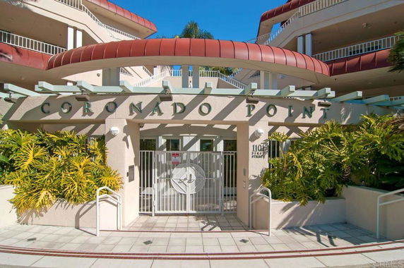 Front view of a building with a gated entrance labeled 'CORONADO POINT'.