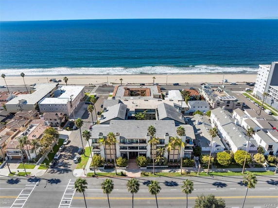 Aerial view of a residential building near the ocean.