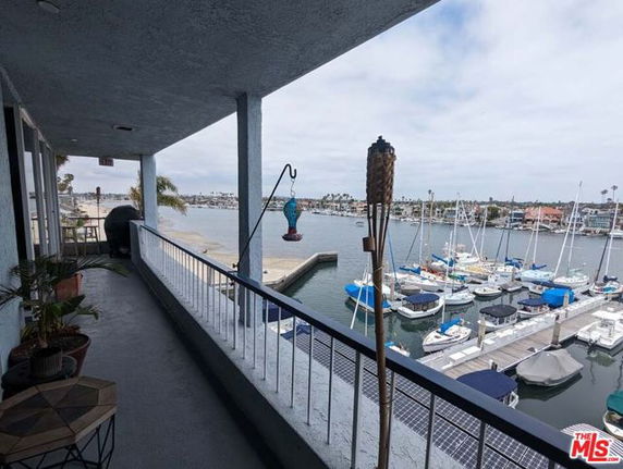 Panoramic view of a marina with boats from a balcony.