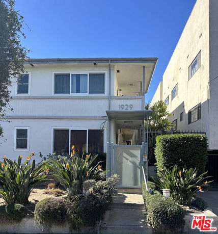 Front view of a two-story building with modern design features.
