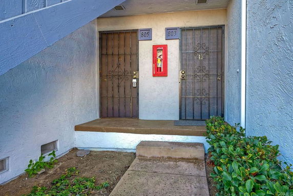Entrance view of a building with two doorways labeled 803 and 805.