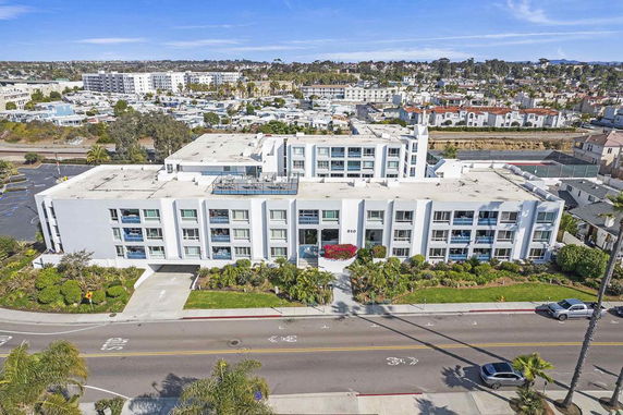 Front view of a multi-story residential building with modern design.
