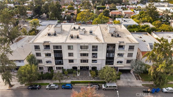 Front view of a multi-story residential building in an urban neighborhood.