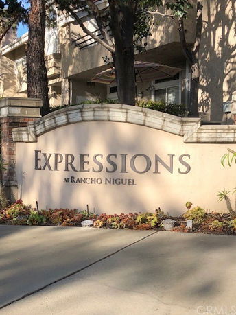 Front view of a building with a sign reading 'Expressions at Rancho Niguel'.