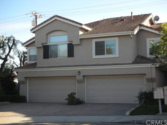 Front view of a two-story house with a double garage.