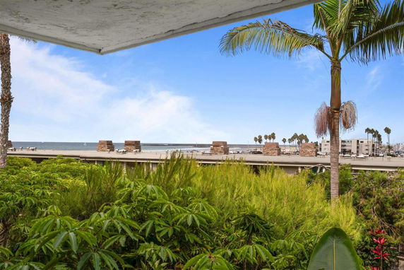 Panoramic view of a coastal area with a boardwalk and ocean in the background.
