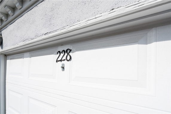 Front view of a garage door with the number 228.