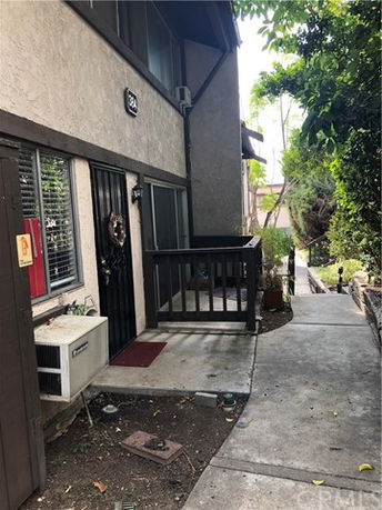 View of building entrance with a small porch area.