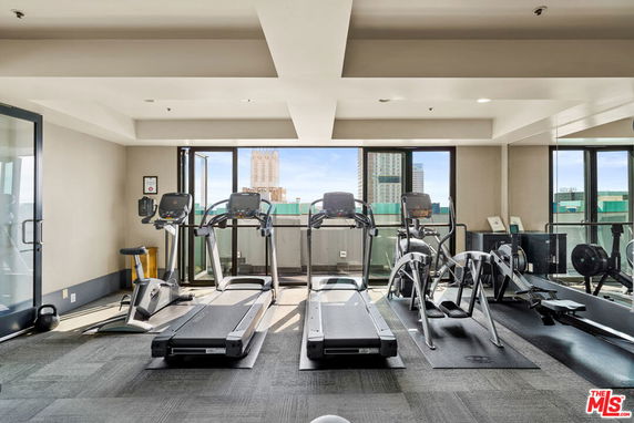 Gym area with treadmills and exercise equipment.