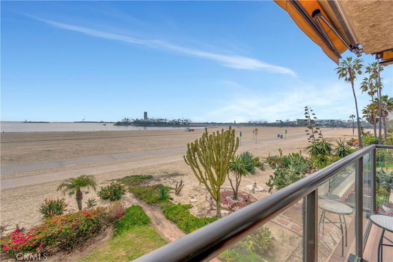 Panoramic view from a building overlooking a beach and ocean.