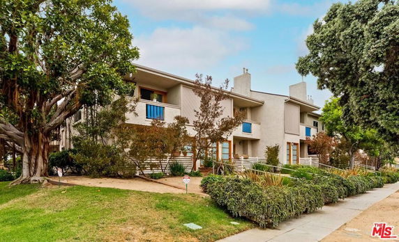 Front view of a two-story residential building with balconies.