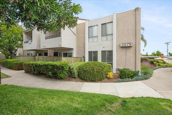 Front view of a two-story residential building with balconies.