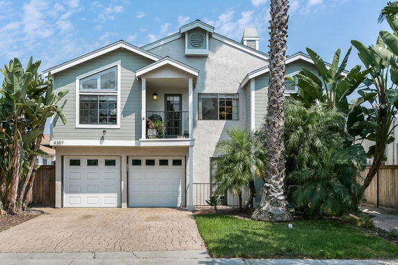 Front view of a two-story house with a double garage.