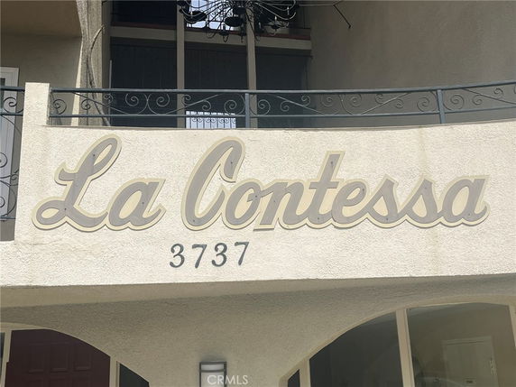 Front view of a building with 'La Contessa' signage and decorative railing.