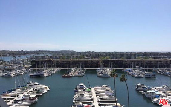 Panoramic view of a marina with several boats docked.