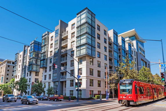 Front view of a multi-story apartment building with modern design.