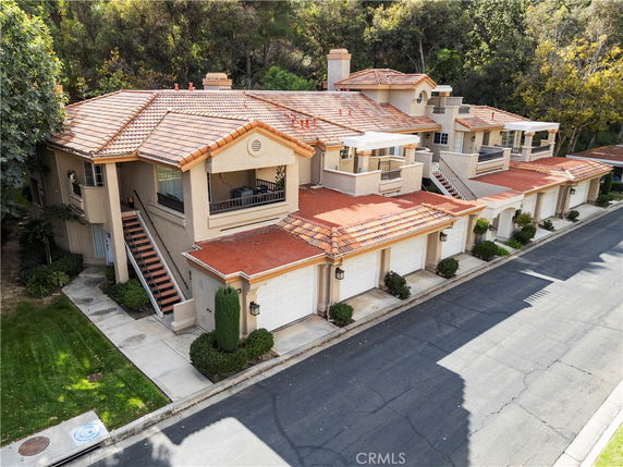 Front view of a multi-story building with garages.