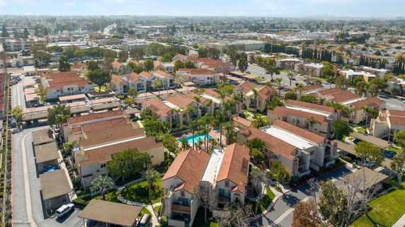 Aerial view of a residential area with multiple buildings and streets.