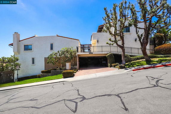 Front view of a multi-story house with a garage.